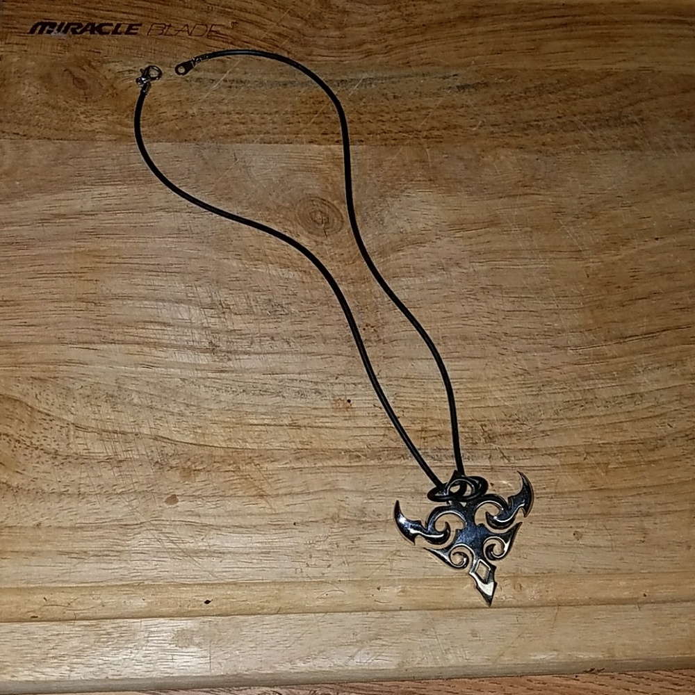 Black necklace with tribal type dangle.